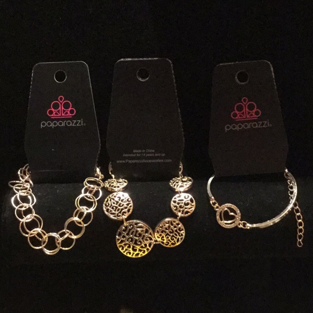 3 Rose Gold Bracelets.